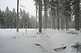 Geodetický bod na rozsáhlé vrcholové plošině Břemene, 250 m jižně od vrcholu.